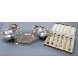 A pair of George V silver sauceboats, a pierced silver two handled dish, a silver vase and cased set