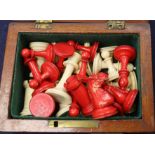 A small Staunton type ivory chess set, in mahogany box, kings 2.5in., missing one red pawn and the