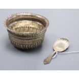 A late Victorian silver sugar bowl and a modern silver caddy spoon.