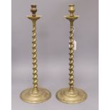 A pair of tall brass spiral candlesticks height 46cm