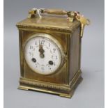 A French brass mantel clock with painted enamel dial height to top of handle hinge 17cm