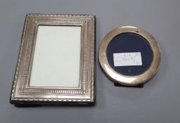 Two modern silver mounted photograph frames including circular, largest 18cm.