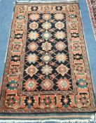 A Caucasian blue ground rug 150 x 90cm