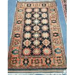 A Caucasian blue ground rug 150 x 90cm