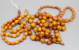 A single strand amber bead necklace, gross 15 grams, one clear amber necklace and two amberoid