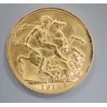 A 1910 gold full sovereign.