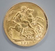 A 1910 gold full sovereign.