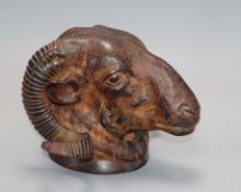 A bronze ram's head depth 14cm