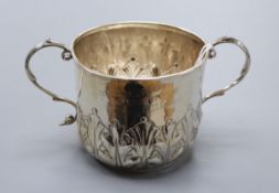 A late Victorian embossed silver porringer, John Henry Rawlings, London, 1889.