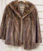 A beige mink jacket