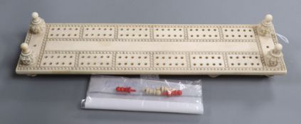 An ivory cribbage board