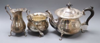 A George V silver three piece silver tea set by Robert Pringle & Sons, London, 1921, and a pair of