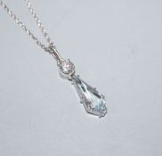 A modern Swedish 18ct white metal, diamond and shaped aquamarine set pendant, on a 750 fine link