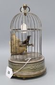 A brass musical automaton bird cage
