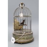 A brass musical automaton bird cage