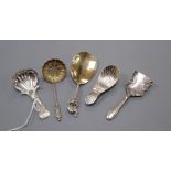 A George IV silver caddy spoons, John Bettridge, Birmingham, 1821, three other silver caddy spoons
