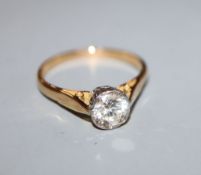 A modern 18ct gold and solitaire diamond ring, the stone weighing approximately 0.80cts, size Q.