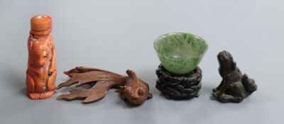 A Chinese stained coral snuff bottle modelled as a shrew, a nephrite bowl, a bronze figure, a fish