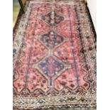 A Belouch red ground rug 240 x 156cm