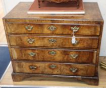 A George II walnut chest of four long drawers W.92cm