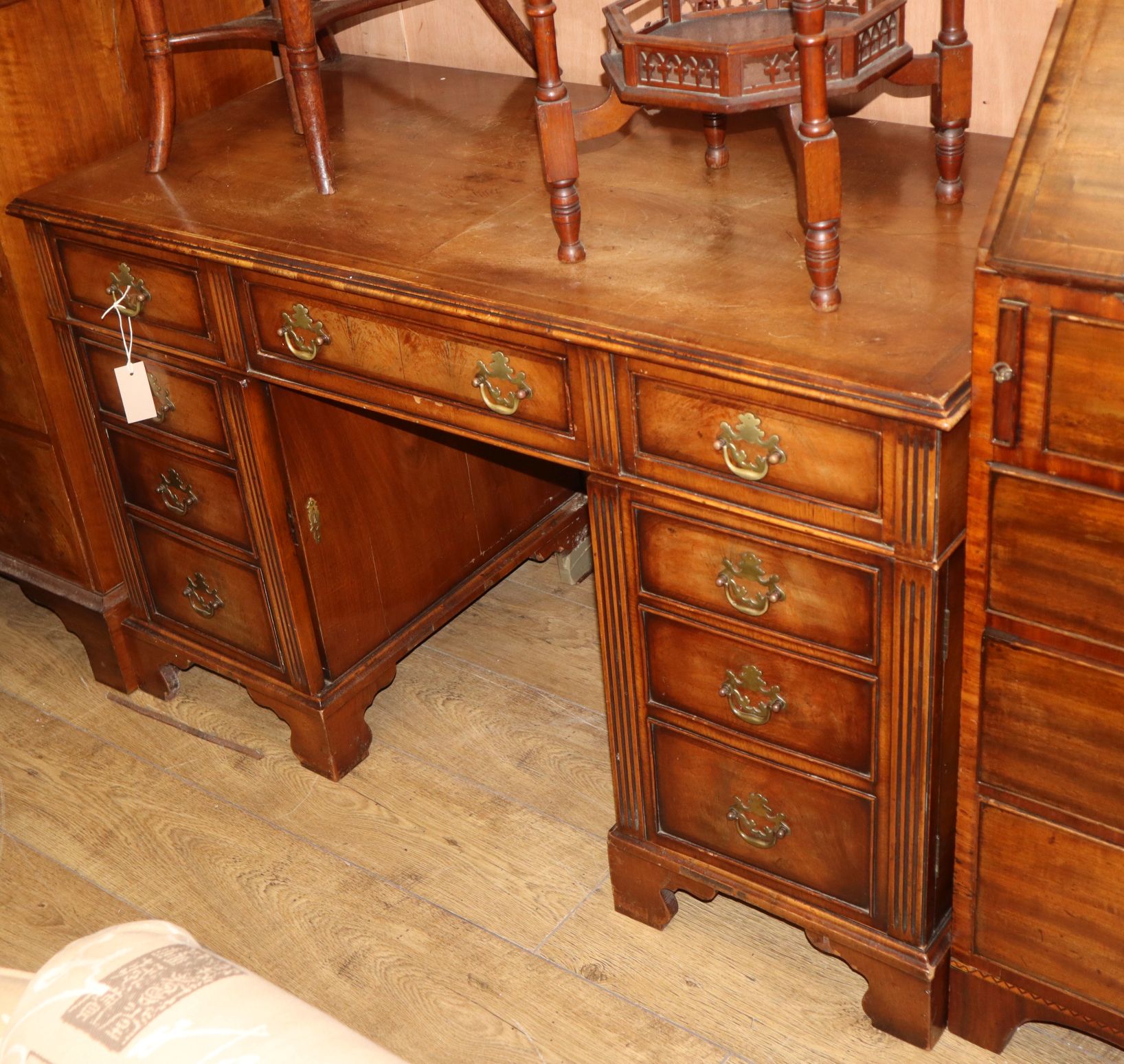 A reproduction walnut pedestal desk W.120cm