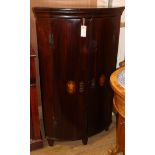 A George III inlaid mahogany corner cabinet W.70cm