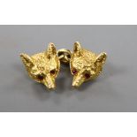 A 9ct gold fox mask single cufflink with inset ruby eyes