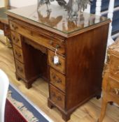 A George III mahogany kneehole desk with brushing slide W.96cm