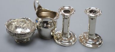 A George III silver helmet cream jug, a 1920's imported German silver bowl and a pair of silver