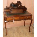 A late Victorian mahogany and beech writing table W.92cm