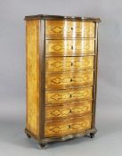 An early 20th century French rosewood and marquetry semanier, with serpentine front and block