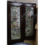 A pair of Chinese porcelain panels, painted with birds and inscribed, in ebonised frames with