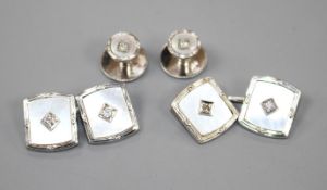 A pair of 9ct white gold, mother of pearl and diamond set cufflinks and two matching dress studs.