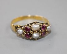 A 19th century 18ct gold, garnet and split pearl cluster dress ring, size L.