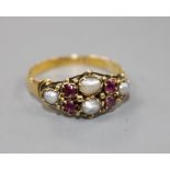 A 19th century 18ct gold, garnet and split pearl cluster dress ring, size L.