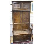 An 18th/19th century elm box seat settle with cupboard over H.205cm