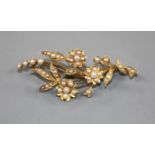 An early 20th century yellow metal and seed pearl set floral spray brooch, 52mm.