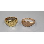 An 18ct signet ring with crest, gross 5.9 grams and a 9ct gold signet ring with monogram, 2.9 grams
