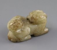 A Chinese pale celadon and brown jade group of a lion dog and cub, 18th / 19th century, L.6.3cm