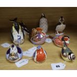 Nine Royal Crown Derby paperweights, gold stoppers, unboxed, including Penguin with Chick,