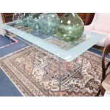 A contemporary wrought iron and glass top rectangular table L.214cm