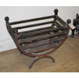 A cast iron fire grate and dogs Fire grate W.56cm