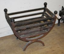 A cast iron fire grate and dogs Fire grate W.56cm