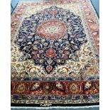 A Tabriz blue ground carpet 340 x 245cm