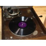 An HMV oak tabletop wind-up gramophone