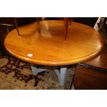 A circular pine kitchen table with painted base. Diameter 130cm