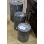 Two Chinese Swatow pewter cylindrical tea canisters and covers and another smaller canister, the