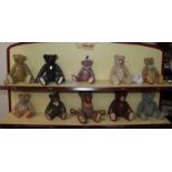 A collection of ten 'Century of Steiff' porcelain bears with buttons in ears and jointed limbs, with