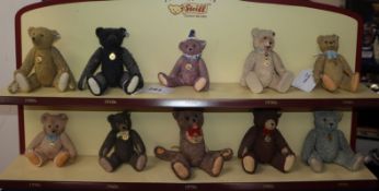 A collection of ten 'Century of Steiff' porcelain bears with buttons in ears and jointed limbs, with