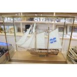 A cased model of a French naval schooner 'The Marseille 1764', in glazed case overall 84 x 63cm